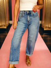 High-waisted light blue denim vintage washed seam shift jeans with relaxed straight-leg cut and rolled cuffs