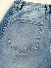 Back side of light-wash denim vintage washed seam shift jeans with classic pocket stitching and belt loops