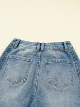 Light-wash denim vintage washed seam shift jeans with high-rise waist and classic back pockets shown from the back
