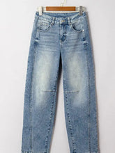 Light-wash denim vintage washed seam shift jeans with high-rise straight-leg cut and subtle fading