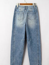 Light-wash denim vintage washed seam shift jeans with relaxed wide-leg cut and subtle fading for a casual stylish look