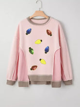Pink waffle color block patchwork loose sweatshirt with sequin christmas light decorations and gray ribbed trim