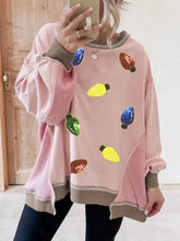 Pink oversized waffle color block patchwork sweatshirt with colorful sequin christmas light embellishments gray cuffs