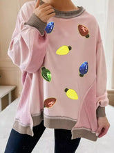 Pink waffle color block patchwork loose sweatshirt with sequin christmas light bulb embellishments and gray ribbed cuffs