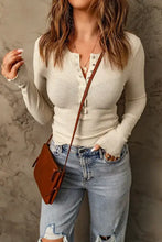 Off-white waffle knit half snap long sleeve henley top with ruffled cuffs