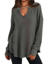A cozy olive green waffle knit long sleeve sweatshirt with keyhole neckline and slightly stretchy fabric machine wash cold tumble dry low