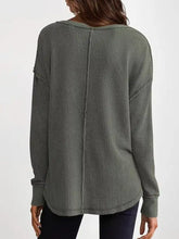 Olive green waffle knit long sleeve sweatshirt with ribbed texture, relaxed fit, slightly stretchy, machine wash cold, tumble dry low