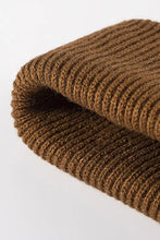 Folded brown ribbed knit fabric for warm winter knit beanie