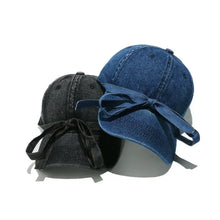 Two washed bow denim baseball caps in dark blue and black