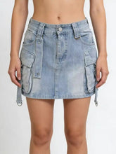 Light-wash denim skirt featuring multiple pockets and adjustable side straps in a washed cargo denim design