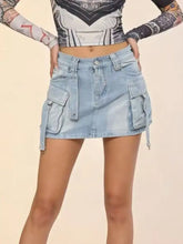 Light-wash denim skirt featuring multiple cargo pockets and drawstring ties in a washed cargo denim style