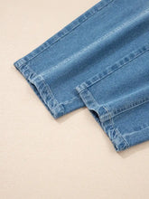Light-wash denim cuffed barrel jeans with neatly stitched cuffs and a classic slightly faded blue hue