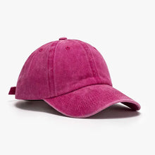 Vibrant fuchsia distressed cotton baseball cap with curved brim