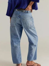 Light-wash denim washed relaxed fit jeans with a relaxed fit and classic back pockets shown from the back side
