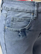 Back view of light-wash denim washed wide leg jeans featuring a classic pocket design with silver-toned rivets