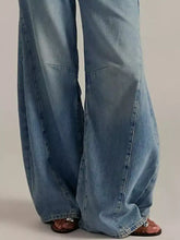 Light-wash denim jeans with a wide-leg cut and visible stitching details in product descriptions and advice sections