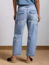 Light-wash denim washed wide leg jeans with a relaxed fit and multiple pockets in a wide leg style