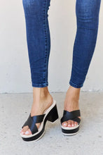Person in Weeboo Cherish Moments contrast platform sandals in black