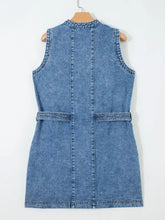 Blue denim sleeveless dress with belted waist and stitched details perfect as a western style sleeveless denim dress