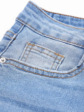 Back side of light-wash denim whiskered wash raw hem cropped jeans with classic pocket brown stitching and silver rivet