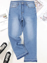 Light-wash denim whiskered wash cropped jeans with a straight-leg cut and raw hem frayed cuffs