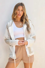 White hooded bomber jacket with beige mesh and quilted details