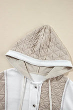 White quilted hooded bomber jacket with beige accents and drawstrings