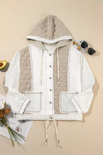 Beige quilted hooded bomber jacket with white accents and drawstring hem