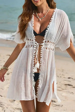 White crochet beach cover-up with pom pom trim and side slits