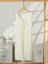 White sleeveless longline cardigan with lace detailing and tie closure