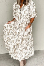 White floral print button-down dress with short sleeves and pockets
