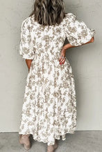 White floral print maxi dress with puff sleeves, elastic waist, pockets