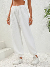 White high waist quilted sweatpants with elasticated cuffs, wide-leg fit