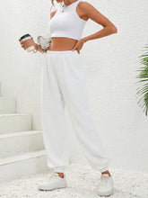 White high waist quilted sweatpants with elastic cuffs, drawstring waist