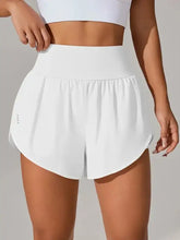 White high-waisted athletic shorts with tennis skirt, pockets, and crotch seam