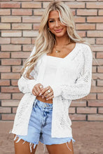 White lace and cable knit cardigan with long sleeves, V-neck, and gold hardware