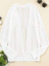 White lace and cable knit cardigan with gold hardware and long sleeves