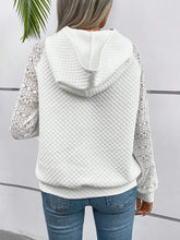 White lace openwork hoodie with quilted design and kangaroo pocket