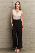 White Lace Plunge Bodysuit with Black Pants