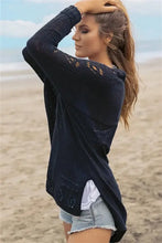 White long sleeve cardigan with black lace, open front, and side slits