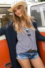 Navy blue long sleeve cardigan with lace, pockets, and slit open design