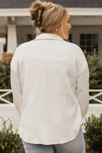 White long sleeve textured blouse with button front
