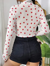 White mesh crop top with red heart pattern and long sleeves