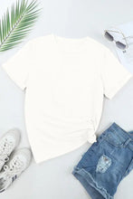 White pumpkin and bow print t-shirt with denim shorts and sneakers