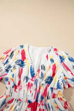 White short puff sleeve tiered midi dress with multicolored abstract print