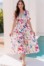 White short puff sleeve tiered midi dress with colorful abstract print