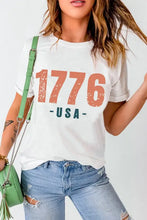 White t-shirt with 1776 USA print in orange and blue for women, basic style