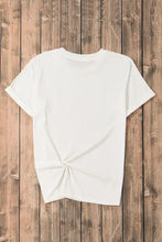 Women’s white t-shirt with colorful star pattern, twist front, short sleeves, round neck, machine wash