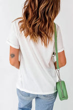 White and green crossbody bag with chain strap and floral heart design