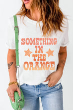White T Shirt with Orange Text for Women